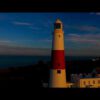 Portland Bill Lighthouse at sunrise - aerial videos database